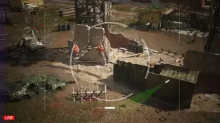 Overhead drone view of orange fibrous growths on poles in Dead Fibers